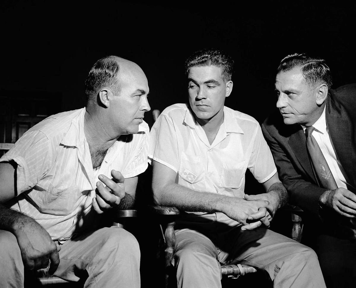 Roy Bryant (left) and JW Milliam (center) in 1955