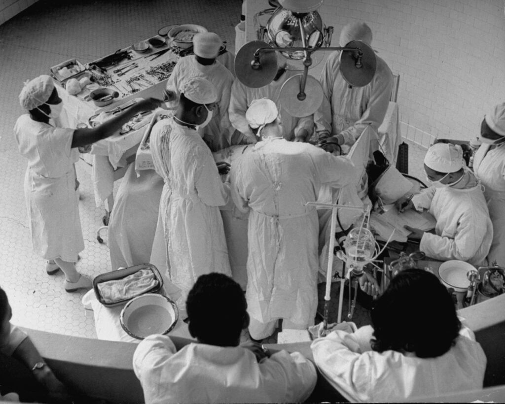 Howard University medical students observed a gall-bladder operation in the amphitheater of Freedman’s Hospital, 1946. Alfred Eisenstaedt/LIFE Picture Collection/Shutterstock