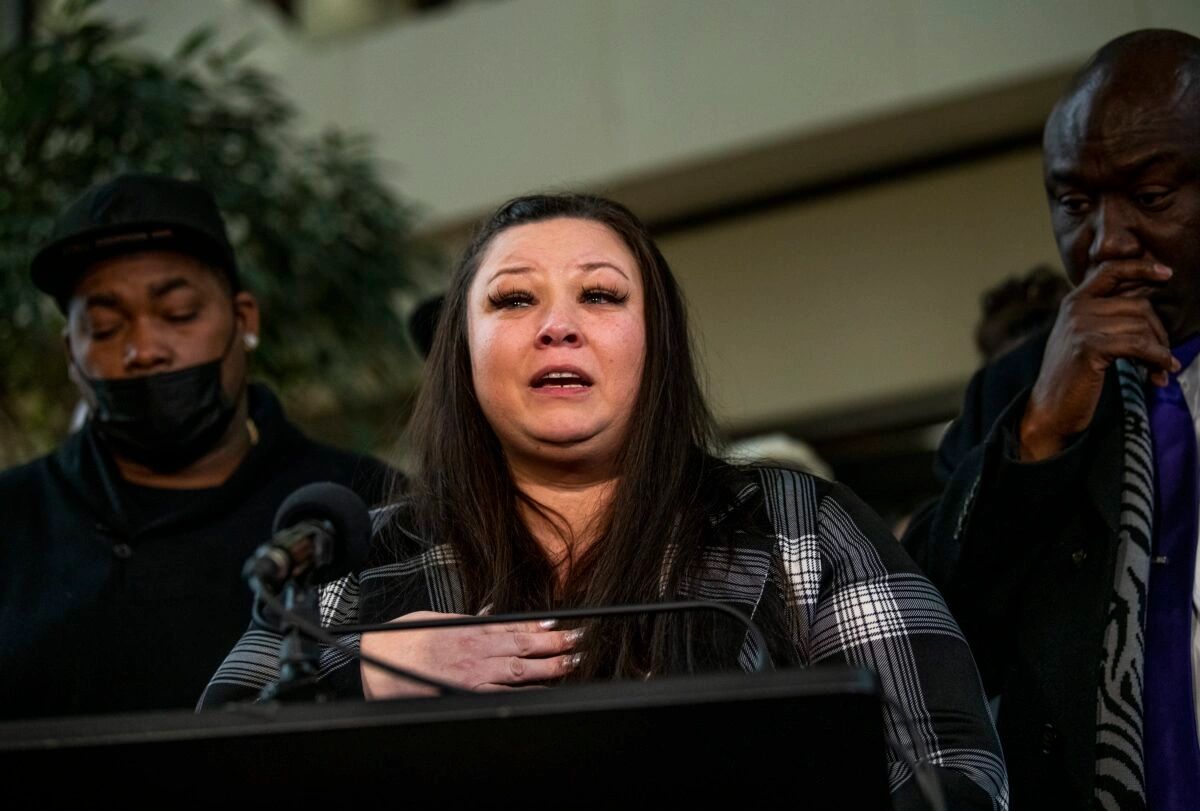 Arbuey Wright, Katie Wright and Ben Crump (l to r) speak at a news conference in Minneapolis after the Kim Potter sentencing