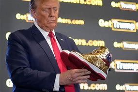 Donald Trump Displaying his Golden Tennis Shoe for Sale