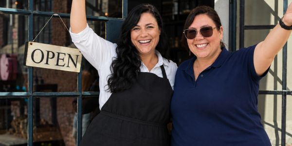 celebrating an opening of a business, seeing success in business development