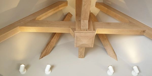 Uplighters illuminating a vaulted ceiling.