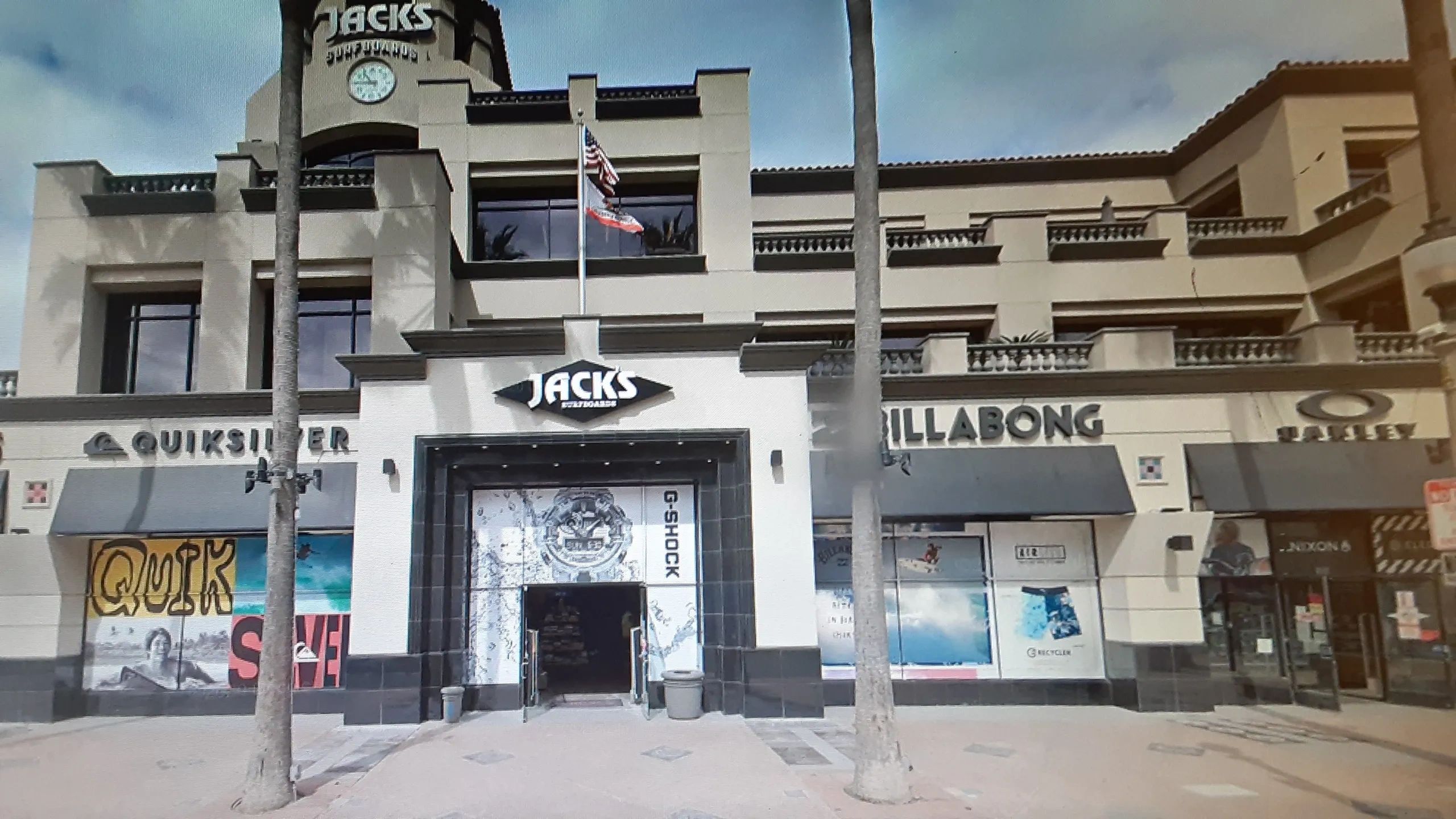 Outdoor view of Jack's Surfboards store with Quiksilver, Billabong, and Oakley nearby.
