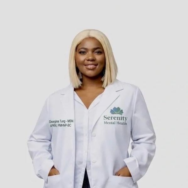 A confident woman in a white medical coat with Serenity Mental Health logo.
