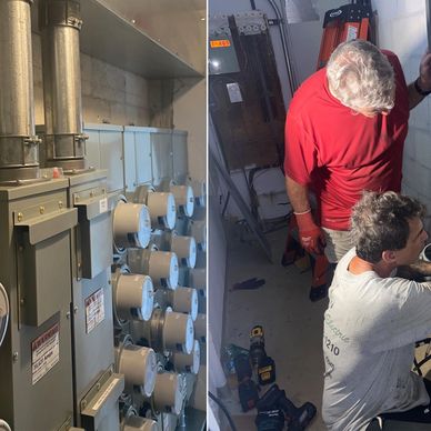 Two technicians working on electrical panels in a utility room.