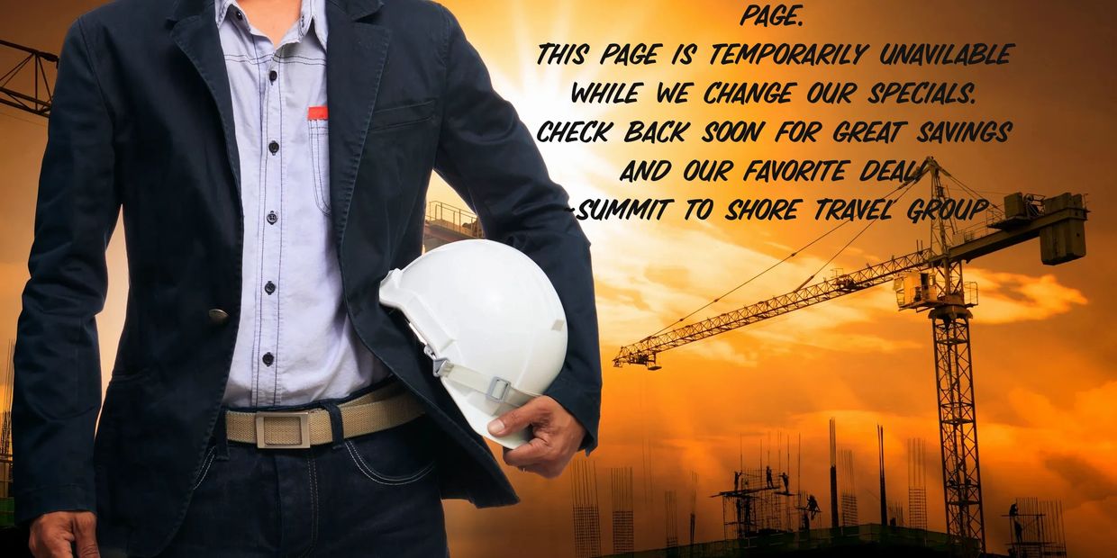 Man with helmet at construction site during sunset.