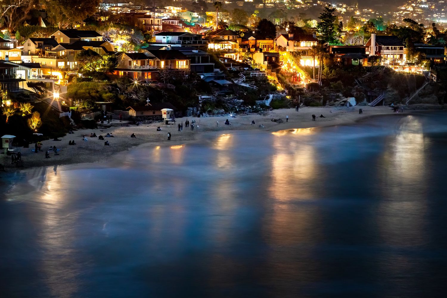 Crescent Bay aglow at night with bioluminescent waves.  Laguna Beach, Orange County, CA. 