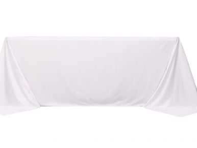 White rectangular tablecloth covering a table.