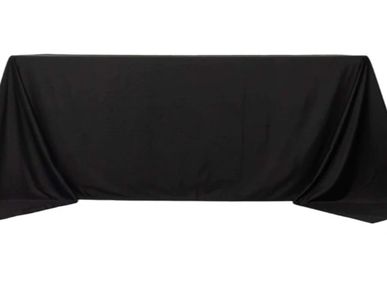 Black tablecloth draped over a rectangular table.
