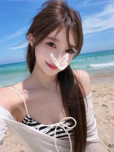 Young woman with butterfly filter at the beach on a sunny day.