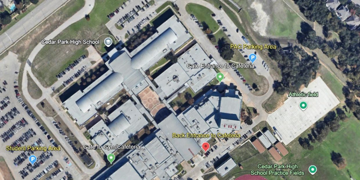 Aerial view of Cedar Park High School campus with parking areas and sports fields.