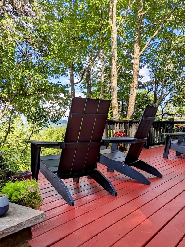 modern mountain home deck with adirondack chairs