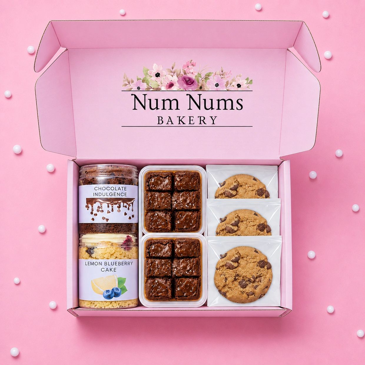 Bakery gift box with cookies, brownies, and cake jars.