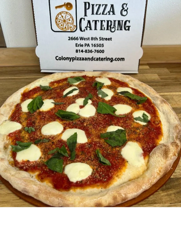 Fresh margherita pizza with mozzarella and basil from Colony Pizza &amp; Catering.