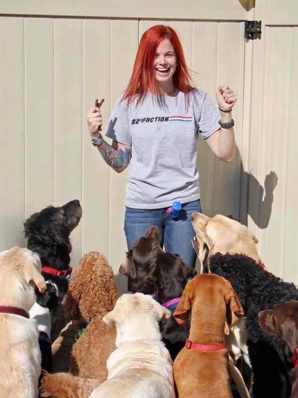 Megan with a group of dogs