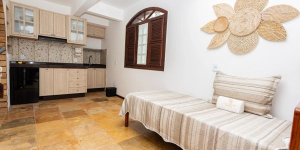 Cozy kitchen and seating area with wooden accents and warm tones.