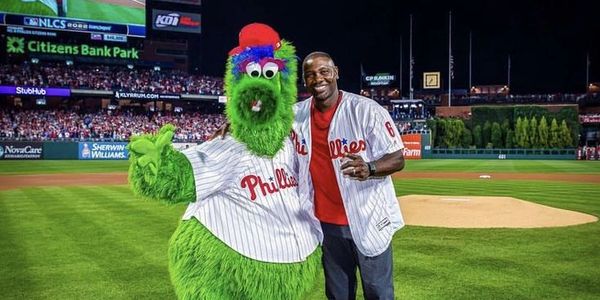 The Phanatic standing on the infield of Citizens Bank Park with former Phillies star Ryan Howard