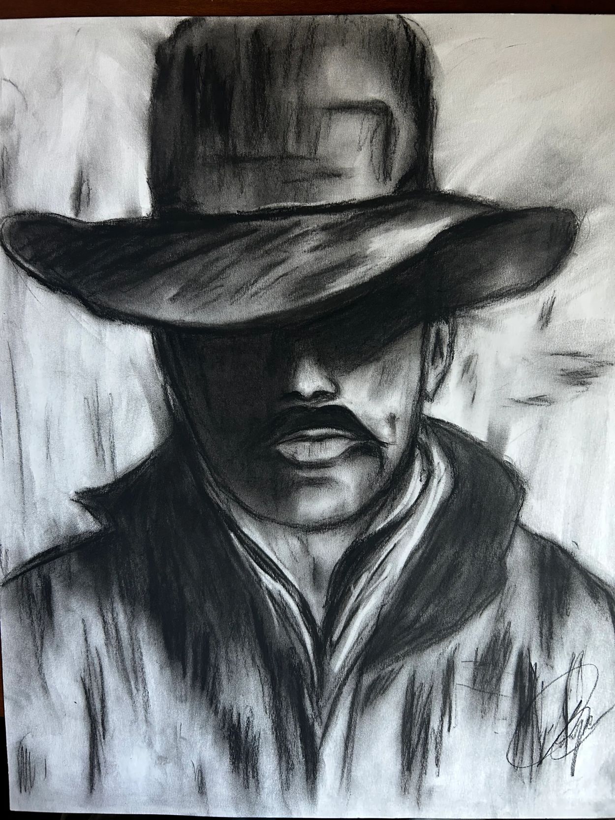 Charcoal drawing of a person wearing a wide-brimmed hat.