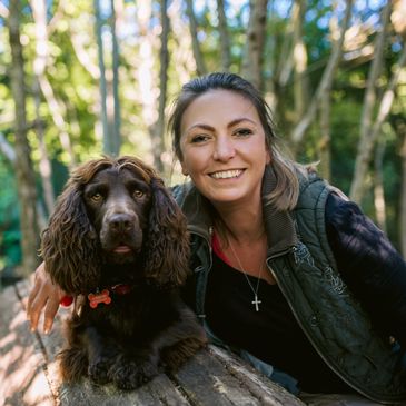 Hannah Molloy with smiling with her spaniel