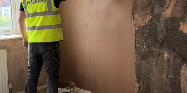 Cee plastering a wall in Glasgow — Truecraft Plastering skimming work