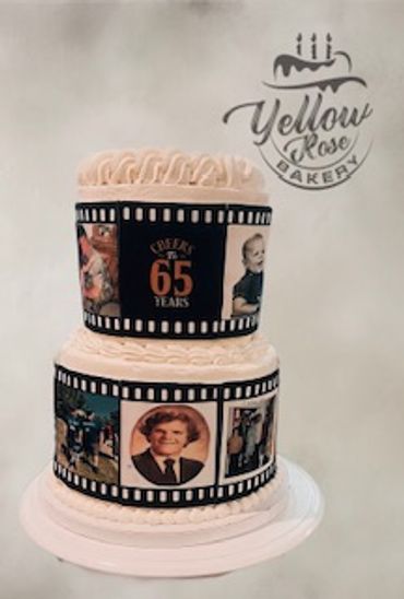 Two-tier cake with photo film strip design celebrating 65 years.