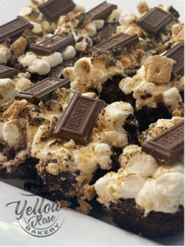 Brownies topped with toasted marshmallows and Hershey's chocolate pieces.