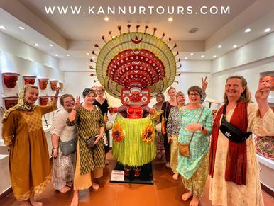 Group of travellers on Theyyam tour visiting local museum 