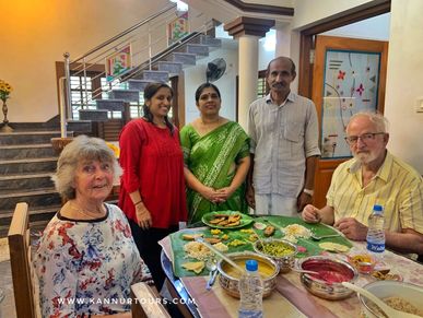 Guests having lunch at a local home in Kannur with family 