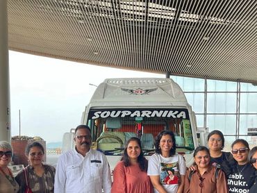 Group travelers from Delhi savor Kannur's cuisine, enjoying local specialties. ExploreKannur. 