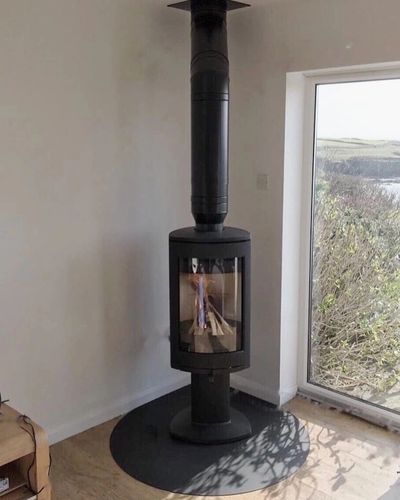 black modern stove in the corner of the room