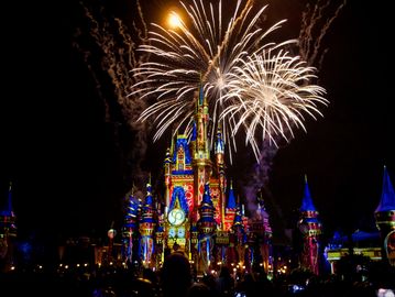 Fireworks light up a castle at night.