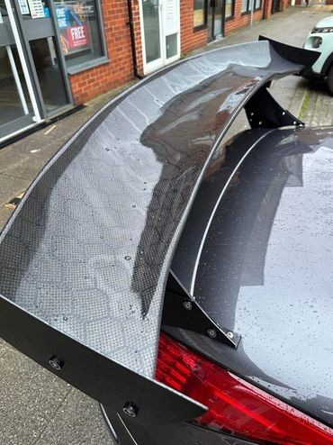 Nissan 350z with large rear wing wrapped in Honeycomb Carbon Fibre 