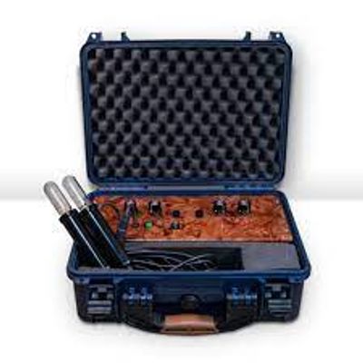 Open black case with electronic equipment and two handheld devices.