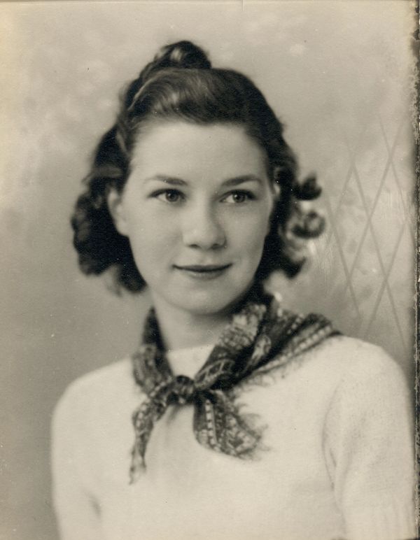 A woman smiling with looking ahead