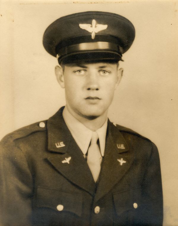 A soldier wearing uniform with looking ahead