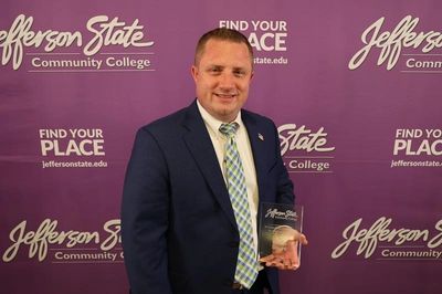 Man holding award