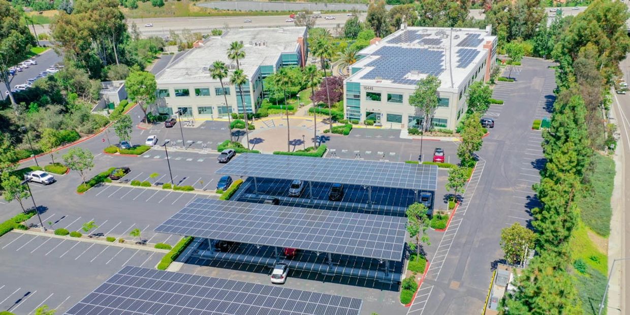 Commercial solar installation on the roof and over the parking lots for added benefits.