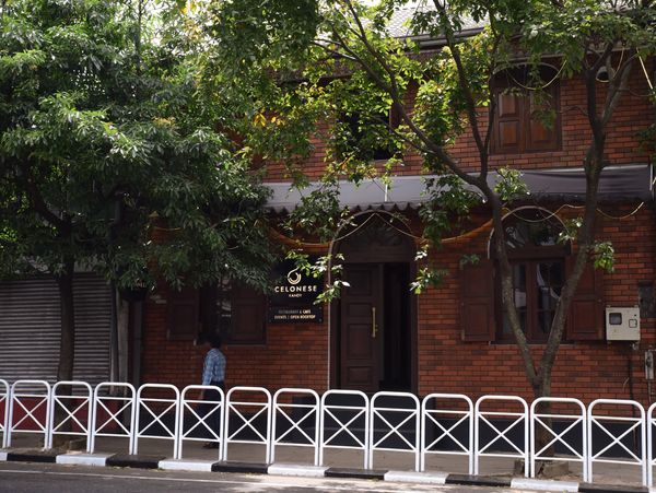 Hotel front view. Surrounded by trees. 