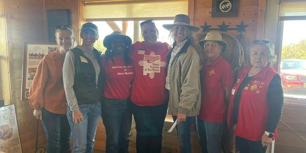 Women Veteran leaders make a donation to Horses for Heroes. 