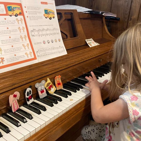 A preschool student using WunderKeys Preschool puppets to learn piano notes, at Home Sweet Piano.