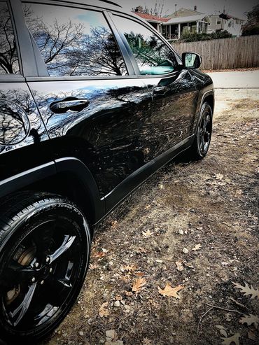 Black on black Jeep Cherokee exterior auto detail. 
