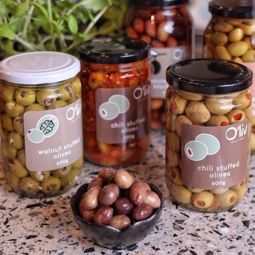 Olives with different stuffings available for over the counter purchases.