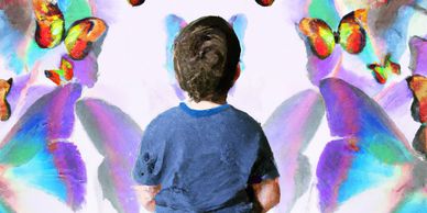 A Child looking at a coloured wall, signifying the need for connection with an experienced therapist
