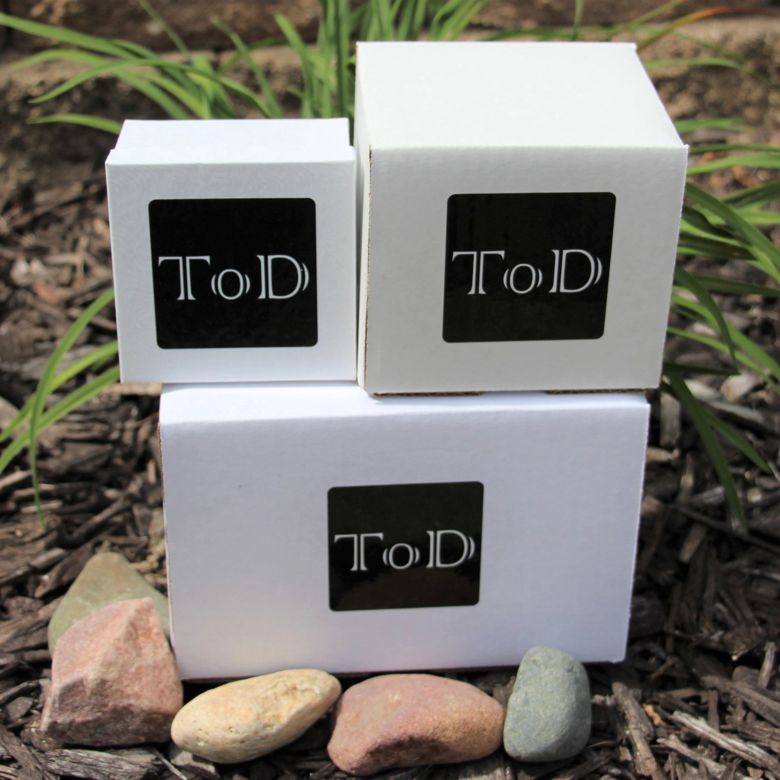 Three white boxes with "ToD" labels stacked outdoors.