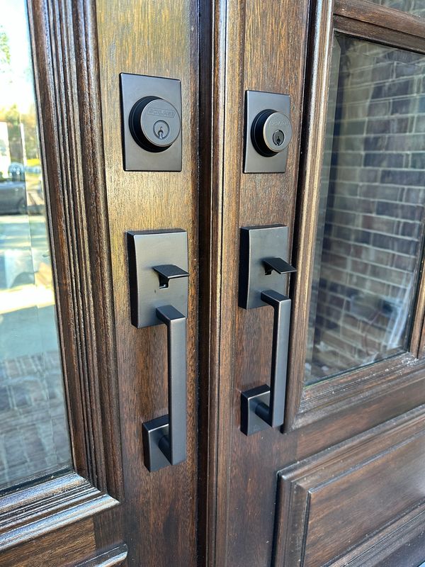 Set of handle sets mounted on double residential doors