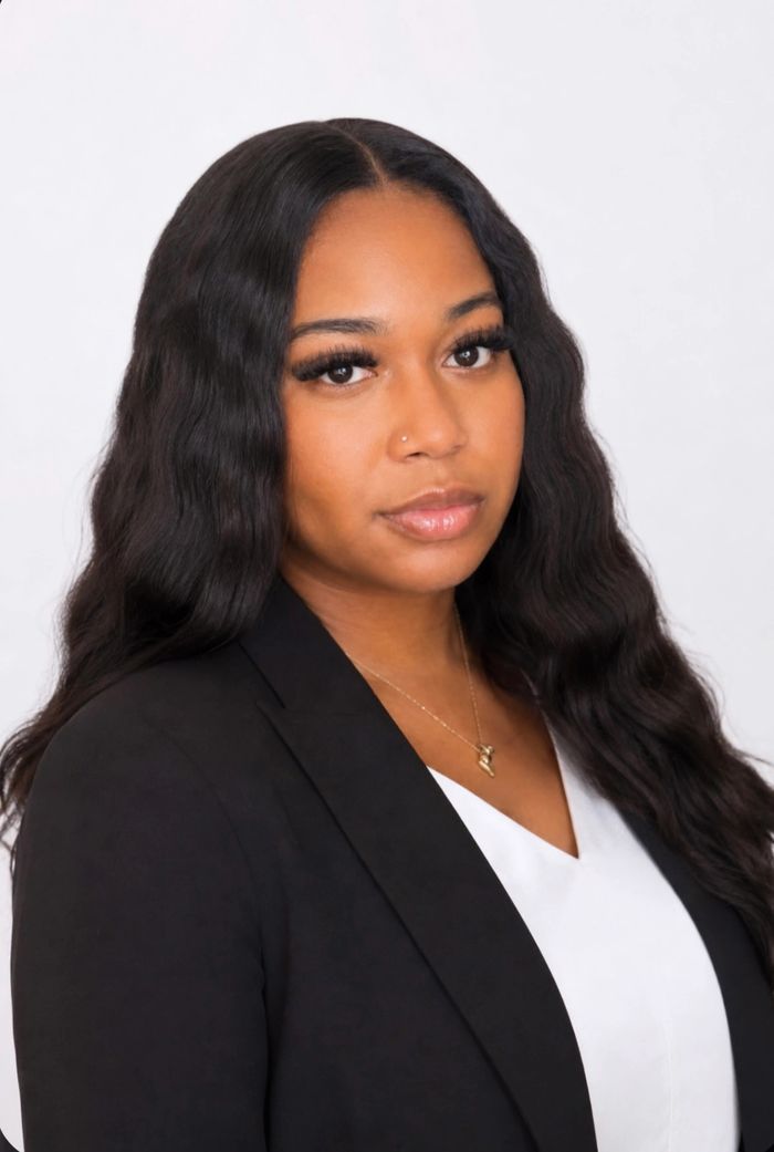A professional headshot of Jalissa Breeland. 