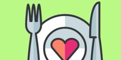 Heart-shaped food on a plate with fork and knife.