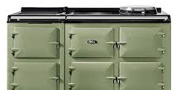 Green and black vintage-style stove with multiple compartments and burners.