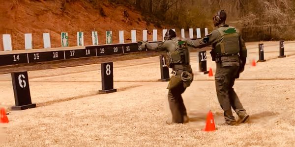 Student and instructor on range