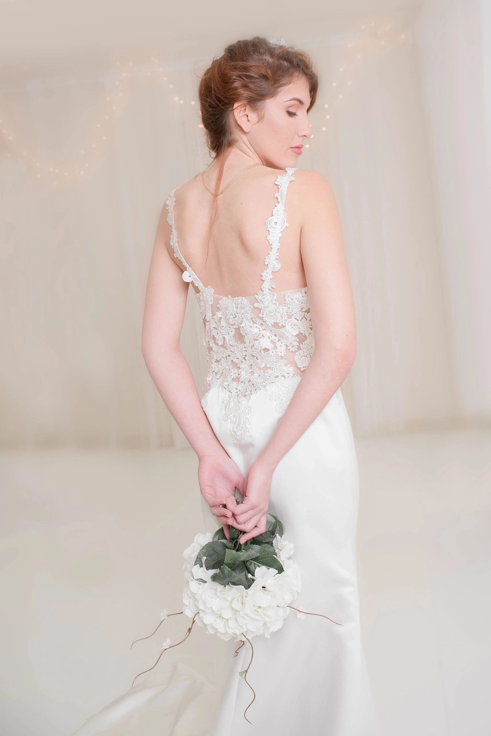 Bride in Wedding dress and boutique flowers